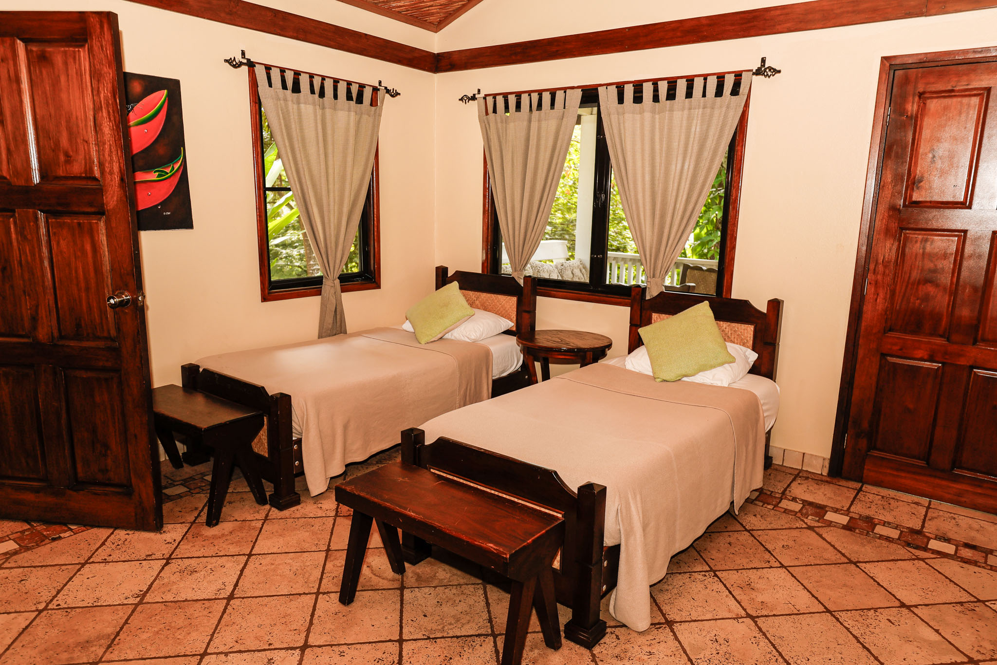 The single beds inside of the Jungle Cottage with Plunge Pool